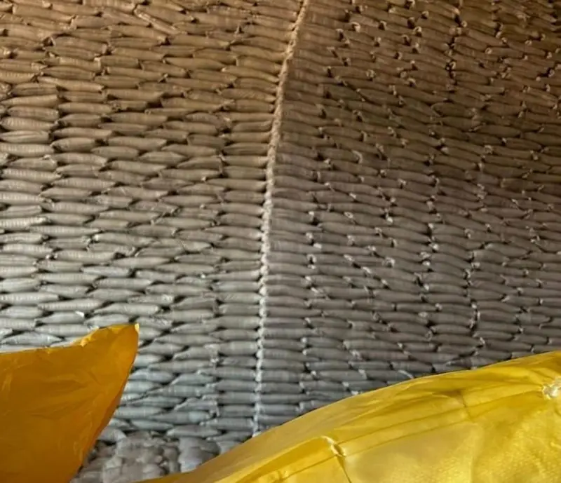 Stacked bags of sugar stored under warehouse conditions